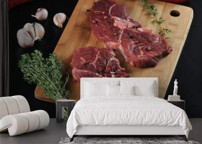 two raw beef steak with spices, peppers Wall mural