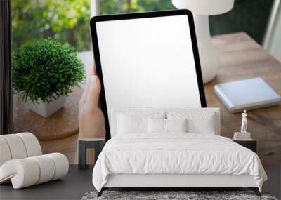 female hands hold computer tablet with isolated screen background table Wall mural