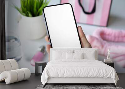 female hands hold phone with isolated screen background pink objects Wall mural