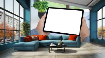 male hands holding computer tablet with isolated screen in office Wall mural