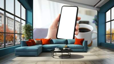 male hands holding phone with isolated screen in office Wall mural