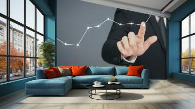 Businessman  Touching stock Graph Indicating Growth Wall mural