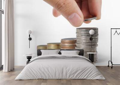 Hand laying coins on stacks coins in  row ,Business idea Wall mural