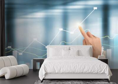 Hand  plan graph growth and increase of chart positive indicators in his business Wall mural