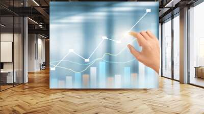 Hand  plan graph growth and increase of chart positive indicators in his business Wall mural