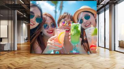 Four Young Women Smiling and Holding Cocktails at a Pool Party Wall mural