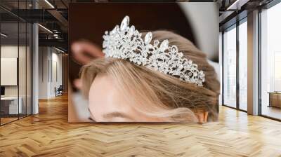 A beautiful tiara on the head of a blonde bride. Close-up Wall mural