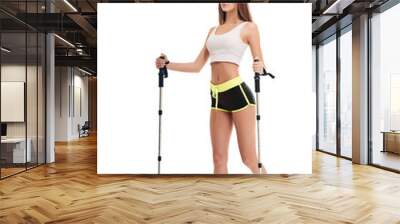 Slim beautiful woman doing nordic walking exercise Wall mural