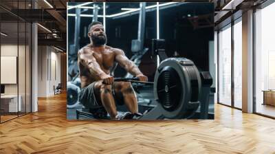 Young strong bearded bodybuilder doing low cable pulley row seated Wall mural