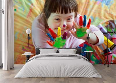 Cute little girl with painted hands Wall mural