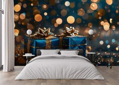 Blue Christmas gift boxes with gold bow on blue defocused holiday background Wall mural