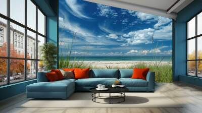 Pristine beach with white sand, dune grass, and a stunning blue sky with wispy clouds. Wall mural