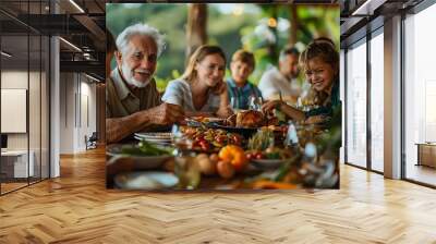 A joyful gathering around a festive meal with family and friends in a natural setting. Wall mural