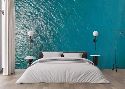 Aerial top view water surface background. Bird eye sea surface photo. Blue ocean from above. Minimal. Wall mural