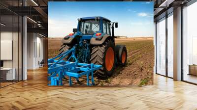 The Tractor - modern farm equipment in field Wall mural