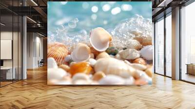 Vibrant seashells of various colors are scattered on a beach as waves crash on them, creating a beautiful and lively seaside scene near the shore with clear blue water. Wall mural