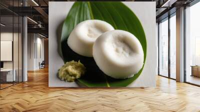 Steaming Idli Delight, Soft and fluffy white, textured to perfection, isolated on a subtle banana leaf background Wall mural