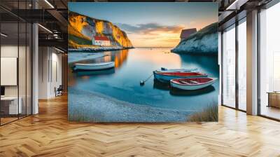 Tranquil bay with three boats at sunrise and a white house on the cliffside. Wall mural