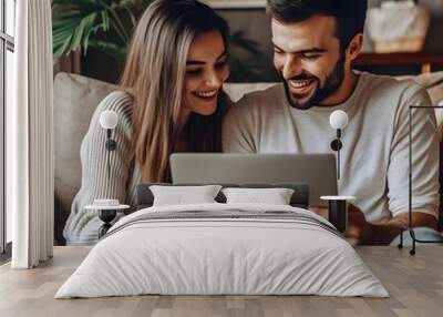 Happy wife and husband using laptop at home, make video call to family using application, watching on-line movie via digital streaming subscription services, enjoy pleasant pastime at home on internet Wall mural