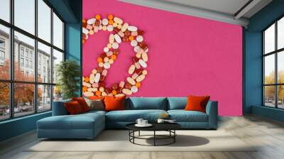 Forbidden sign shaped colorful pills, top view image of forbidden sign shaped colorful pills. No to antibiotic addiction concept image, isolated pink background with copy space. Banner design idea.  Wall mural