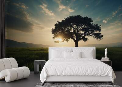 World environment day concept Silhouette alone tree on beautiful meadow wallpaper background Wall mural