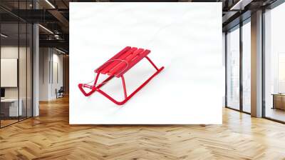 Metal red sledge in the snow Wall mural