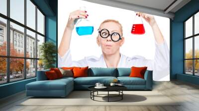 portrait of a mad lab technician with two flasks of colored substances on a white background Wall mural