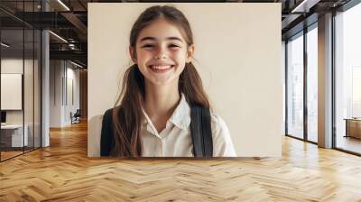 Smiling Schoolgirl with Backpack Against Solid Background Wall mural