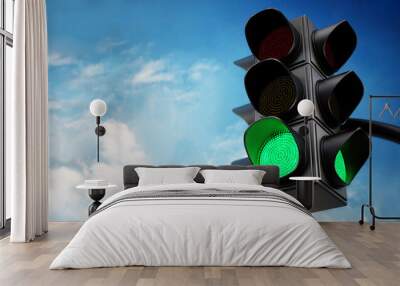 Green traffic light against blue sky. 3D illustration Wall mural