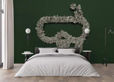 3d rendering of dollar cash rolls and stacks in shape of symbol of diving goggles on green background Wall mural