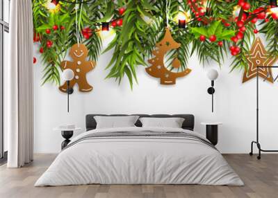 Christmas border with fir branches, pine cones, holly, and string lights. Merry Christmas background with open space for your text. Wall mural