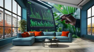 ESG environment. Business investment strategy concept. Businessman pointing to a green data graphs Wall mural