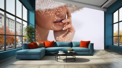 Portrait of a beautiful woman in a straw hat with french manicure. Cosmetics,makeup and beauty. Spa. Copy space Wall mural