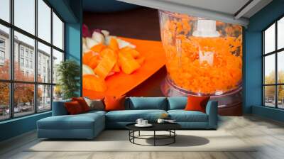 Carrots for borsch in an electric chopper. Soup cooking. Wall mural