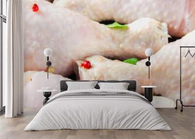 Raw chicken legs in a frying pan on a wooden table. Meat ingredients for cooking.. Banner Wall mural