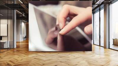 Blank Screen Of A Business Tablet Touched By A Female Finger Wall mural