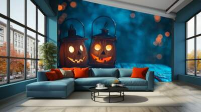 Two halloween lanterns with evil eyes and face on a wood table with a spooky dark blue background at night with light bokeh. Wall mural