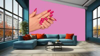 Female hands with pink nail design. Mate pink nail polish manicure. Female model hands with perfect pink manicure. Wall mural