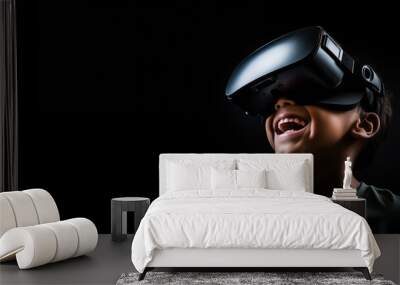 Young boy getting experience using VR headset glasses isolated on a black background with copy space Wall mural