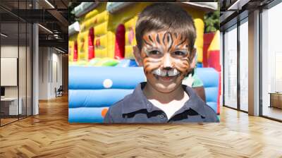 Child with painted face Wall mural