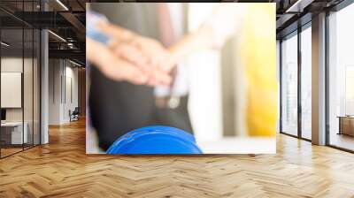 blue safety helmet in team work concept of engineer close up. Wall mural