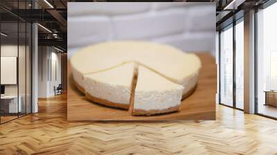 Composition with tasty cheesecake on wooden table Wall mural