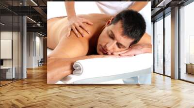 Man receiving massage relax treatment close-up from female hands Wall mural