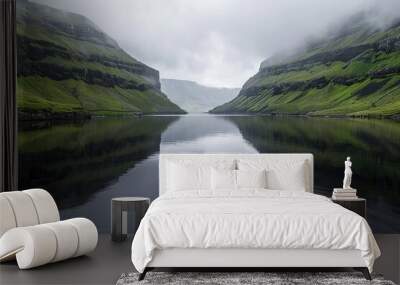 A serene lake in the Faroe Islands surrounded by green cliffs Wall mural