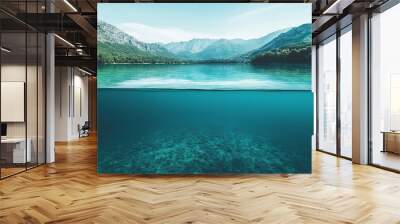 Photo of a lake with clear blue water, half above and below the surface Wall mural