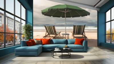 Umbrella and two chairs on the beach prepared for sunbathing by the water by generative ai Wall mural