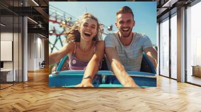 cheerful screaming couple riding on a roller coaster Wall mural