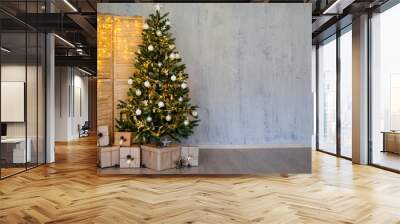 Christmas and new year background - christmas tree, heap of gifts, folding screen with lights and copy space Wall mural