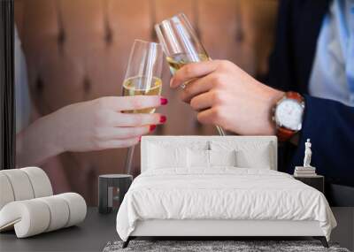 close up of champagne glasses in male and female hands Wall mural