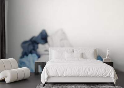 close up of modern iron and wrinkled laundry over white background with copy space Wall mural